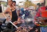 Psie mięso przygotowywane na ulicy w Indonezji