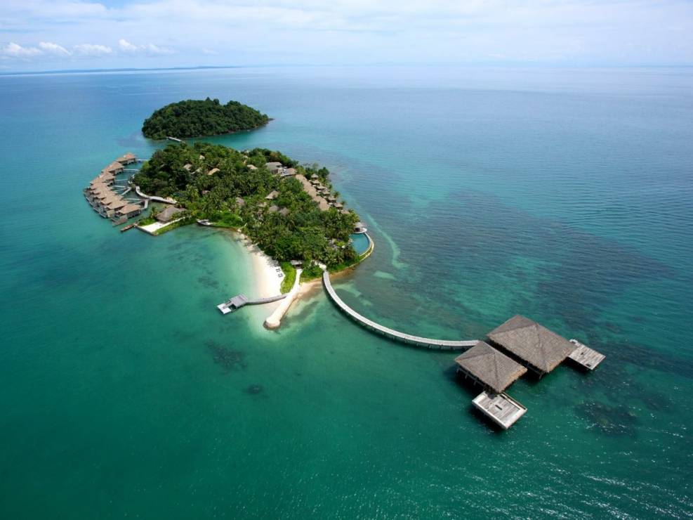 song-saa-private-island-spans-both-the-islands-of-koh-ouen-and-koh-bong-in-cambodia-the-two-islands-are-connected-via-a-footbridge-that-sits-above-a-marine-reserve-and-accommodations-include-over-the-water-villas-with-jungle-and-ocean-views