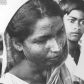 Hinduska, która przeżyła ospę, ale choroba zostawiła na jej twarzy blizny, lata 70. Zdjęcie WHO: L Dale.