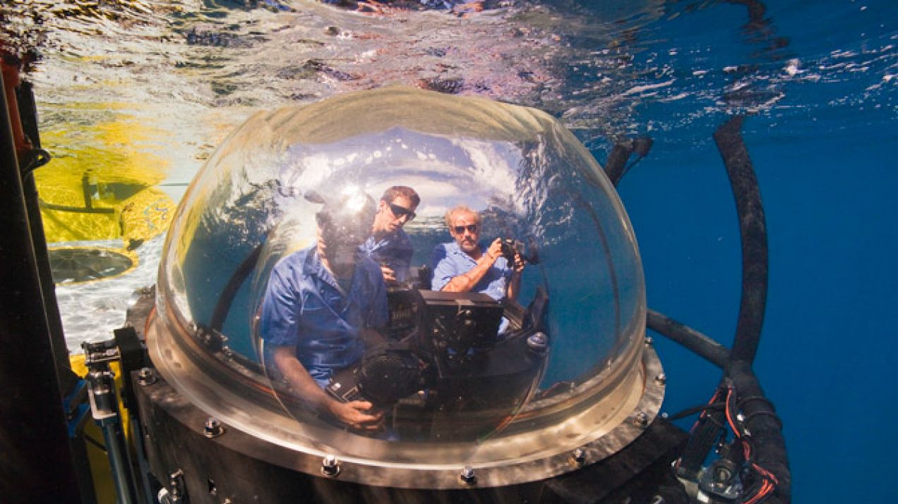 Photographer Brian Skerry, pilot Eli Temime, and author Gregory S. Stone (left to right) start their descent to Las Gemelas seamount aboard the DeepSee in a five-foot sphere with 360-degree views. The submarine, which can drop to 1,500 feet below sea leve